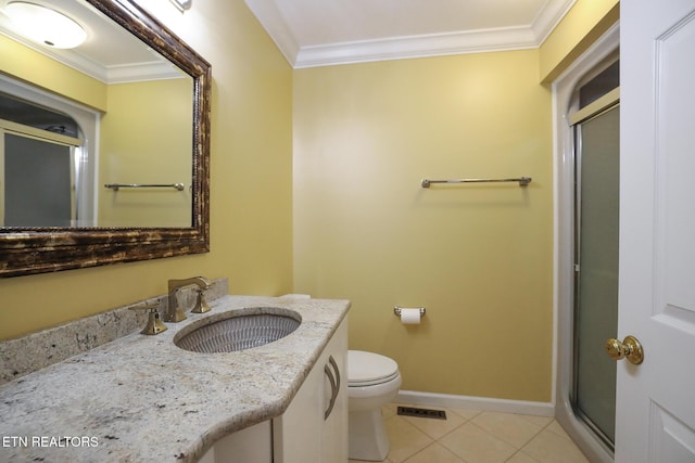 bathroom featuring tile patterned flooring, crown molding, and vanity