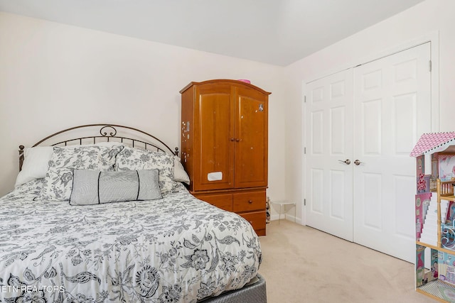 carpeted bedroom featuring a closet