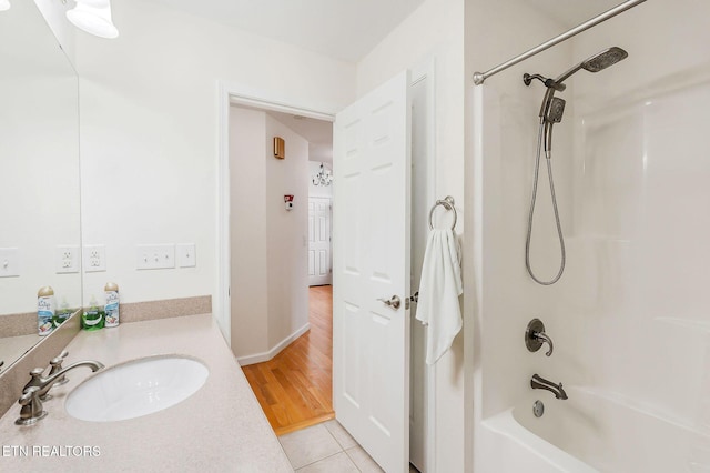 bathroom featuring tile patterned floors, vanity, and shower / washtub combination