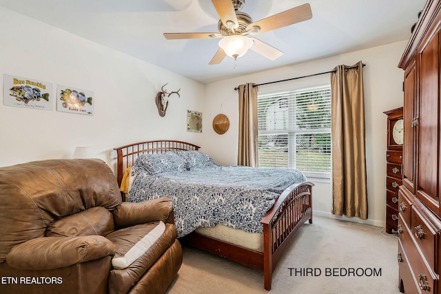 carpeted bedroom featuring multiple windows and ceiling fan