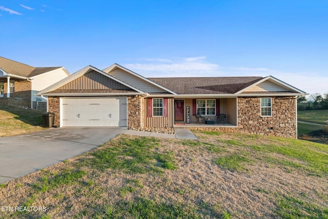 ranch-style house with a porch, a garage, and a front lawn