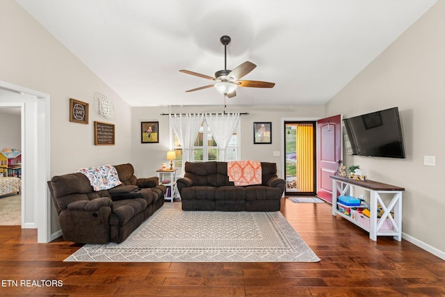 living room with ceiling fan, wood-type flooring, and vaulted ceiling