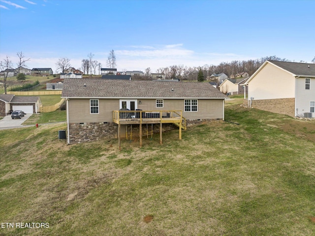 back of property featuring a yard and a deck