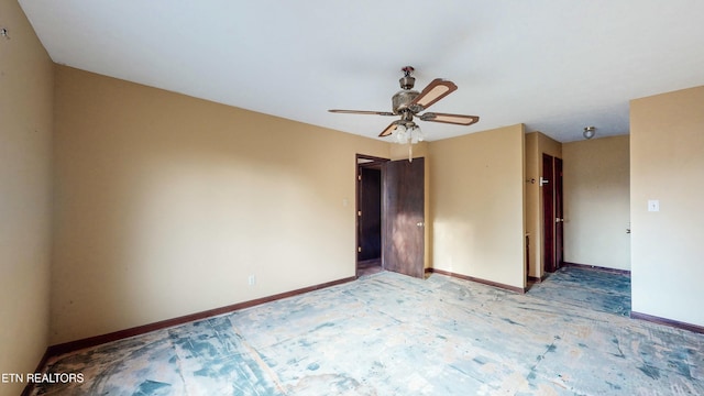 unfurnished room with ceiling fan