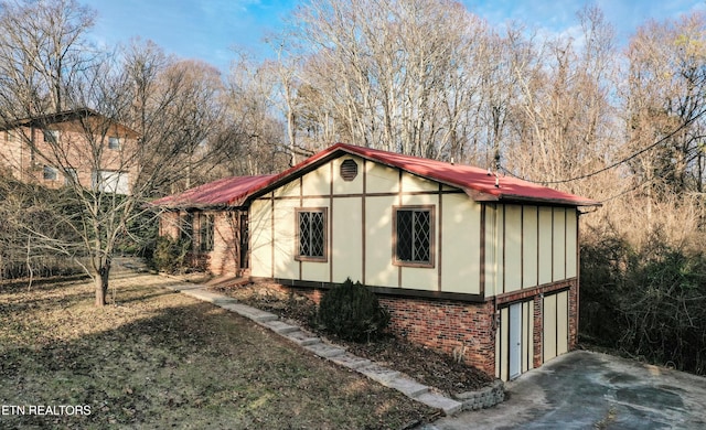 view of side of property featuring a garage