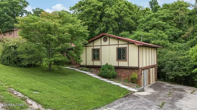 view of outbuilding featuring a yard