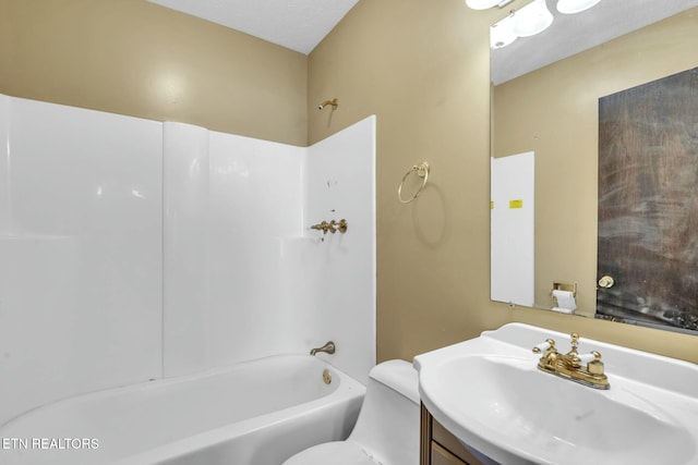 bathroom featuring bathtub / shower combination, vanity, and toilet
