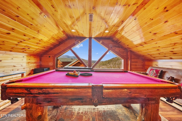 game room featuring wooden walls, lofted ceiling, and pool table