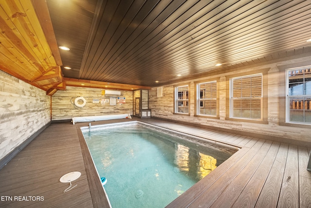 view of swimming pool featuring an AC wall unit