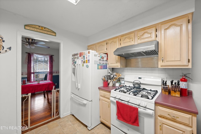 kitchen featuring light brown cabinets, white appliances, decorative backsplash, ceiling fan, and light tile patterned flooring