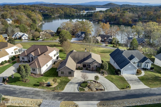 birds eye view of property featuring a water and mountain view