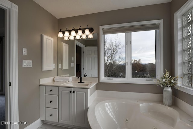 bathroom featuring a bath and vanity