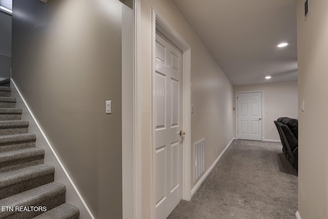 corridor with carpet flooring