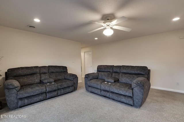 living room featuring carpet and ceiling fan