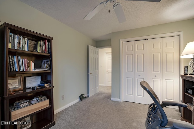 office with light carpet, a textured ceiling, and ceiling fan