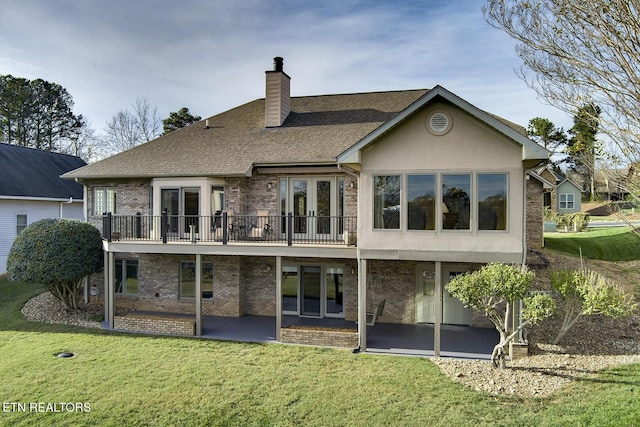 back of house featuring a patio area, a yard, and french doors