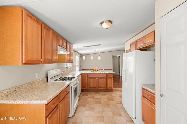 kitchen featuring kitchen peninsula, white appliances, hanging light fixtures, and sink