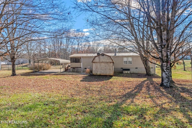 back of house with a carport