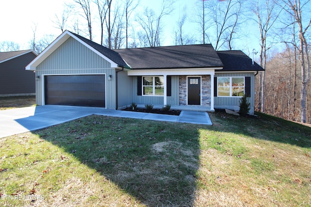 ranch-style home featuring a front yard and a garage