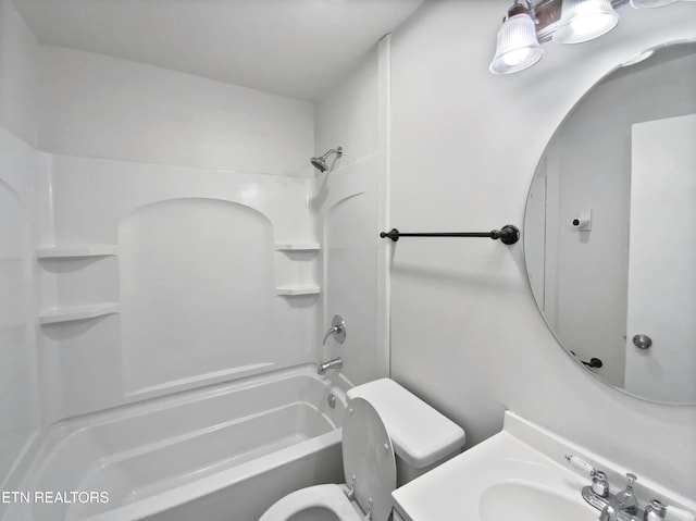 full bathroom with sink,  shower combination, and toilet