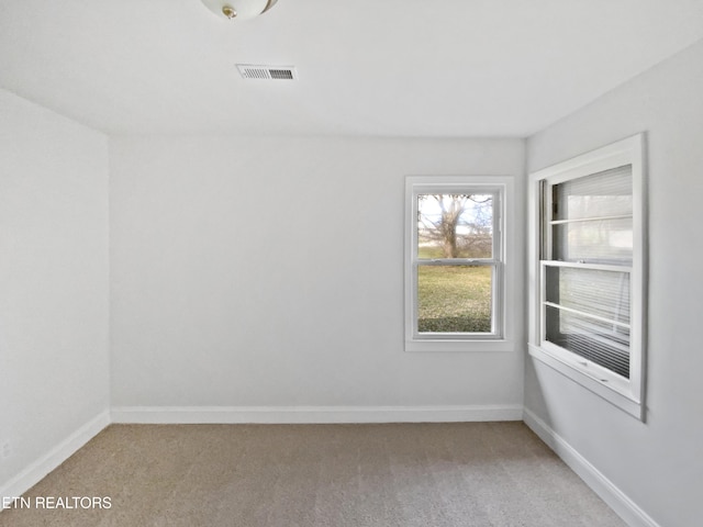 unfurnished room with carpet flooring