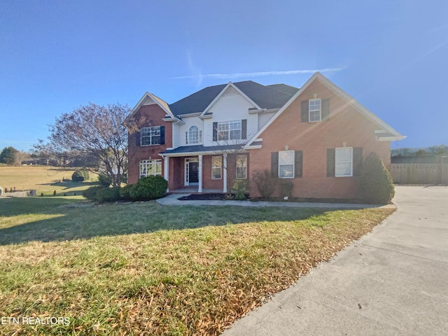 view of property featuring a front yard