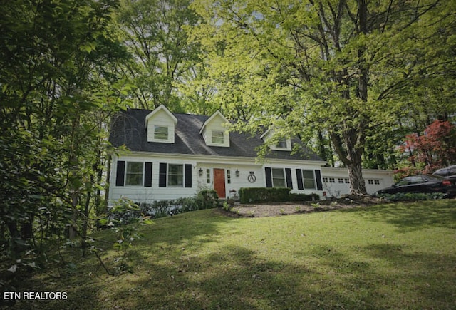 cape cod-style house with a garage and a front yard