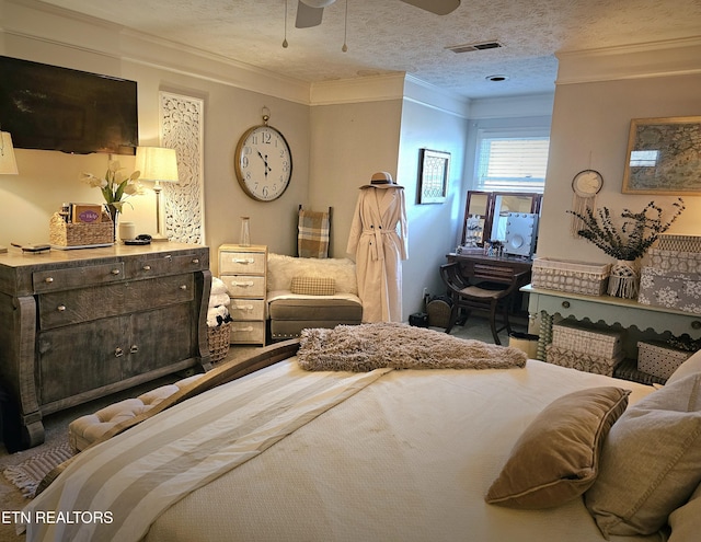 bedroom featuring ornamental molding and a textured ceiling