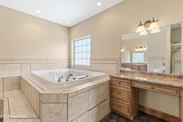 bathroom with separate shower and tub, a wealth of natural light, tile patterned flooring, and vanity