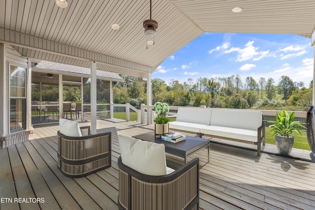 wooden deck featuring outdoor lounge area