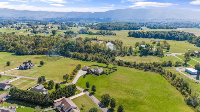 drone / aerial view with a mountain view and a rural view