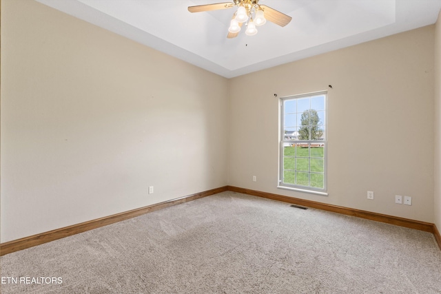 empty room featuring carpet flooring and ceiling fan