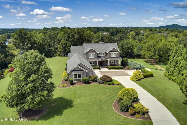 bird's eye view featuring a view of trees