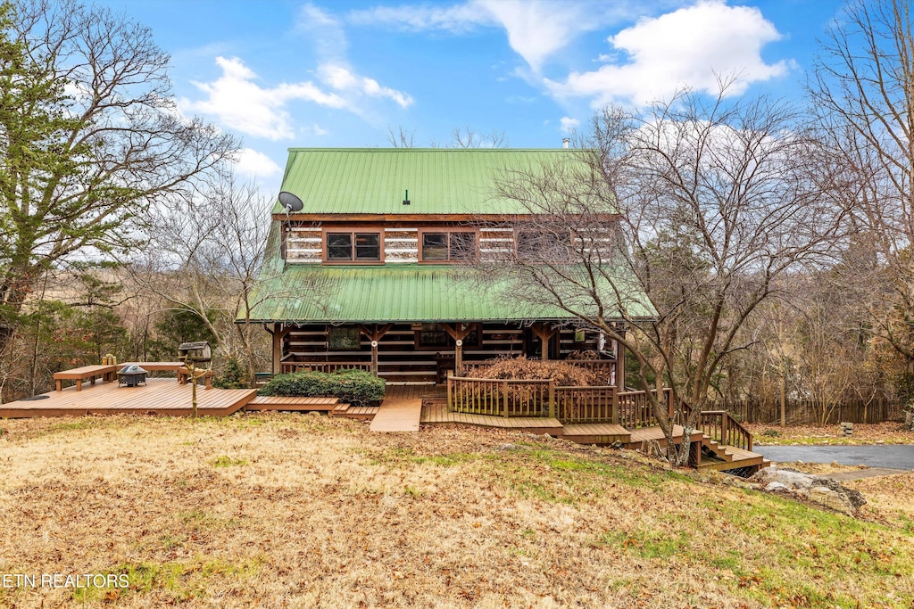 log-style house featuring a deck