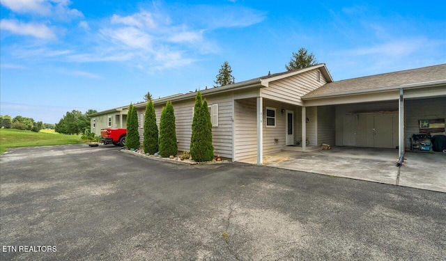 view of side of property with a carport