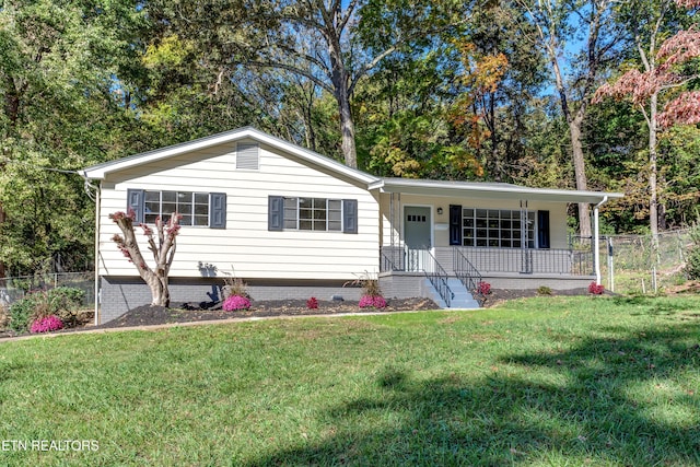 ranch-style house with covered porch and a front yard