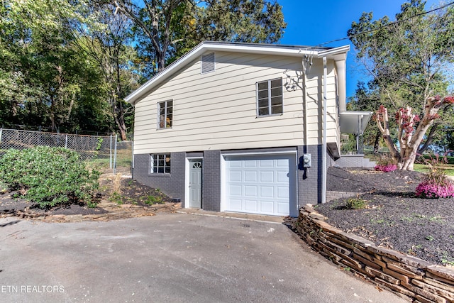 view of property exterior featuring a garage