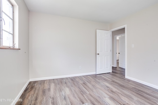 spare room with light wood-type flooring