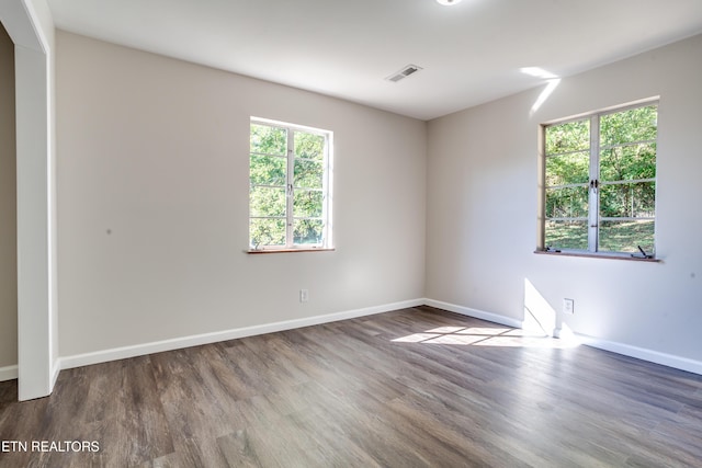 spare room featuring hardwood / wood-style floors