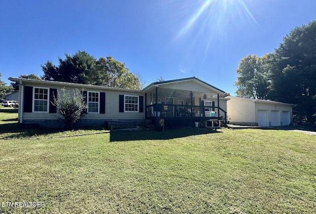 view of front of property with a garage and a front yard