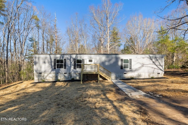 view of front of property with a wooden deck