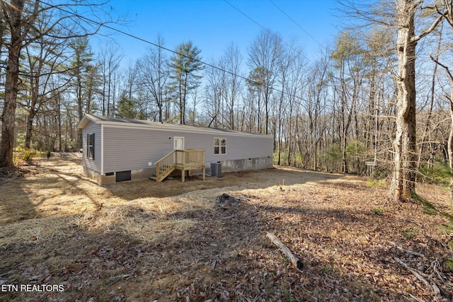 back of property featuring central AC unit