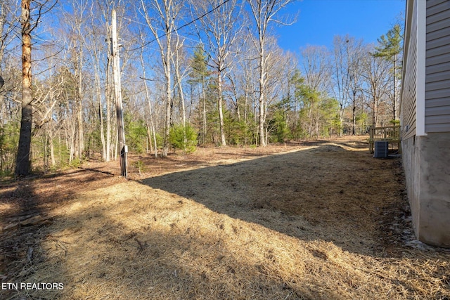 view of yard featuring central AC unit