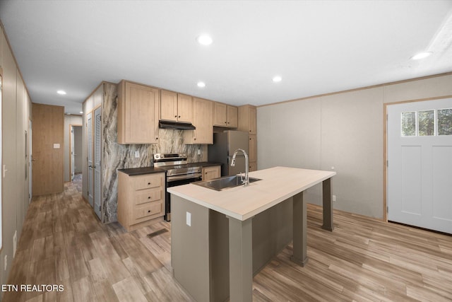 kitchen featuring stainless steel appliances, crown molding, sink, light brown cabinets, and an island with sink