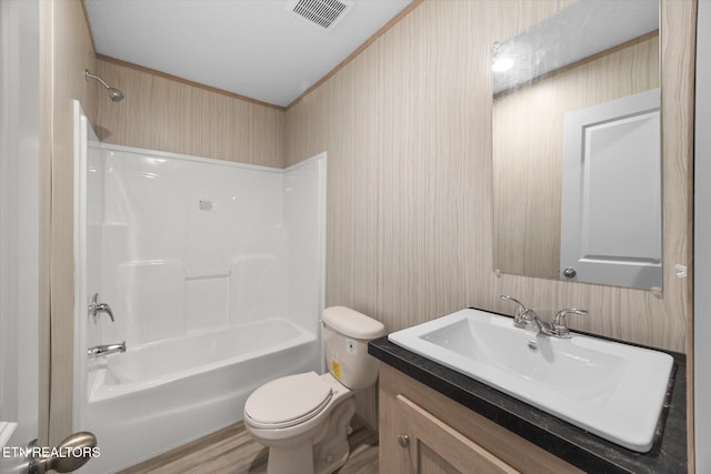 full bathroom with shower / bathing tub combination, vanity, toilet, and hardwood / wood-style floors