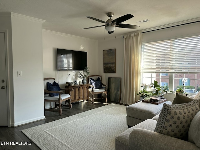 living room with dark hardwood / wood-style floors, ceiling fan, and crown molding