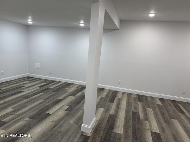 basement featuring dark hardwood / wood-style flooring