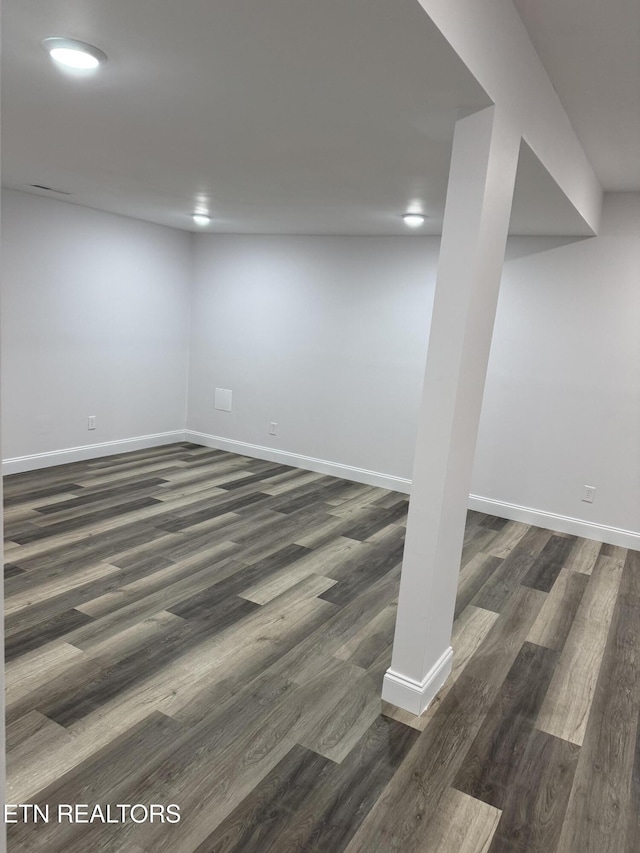 basement featuring dark hardwood / wood-style floors