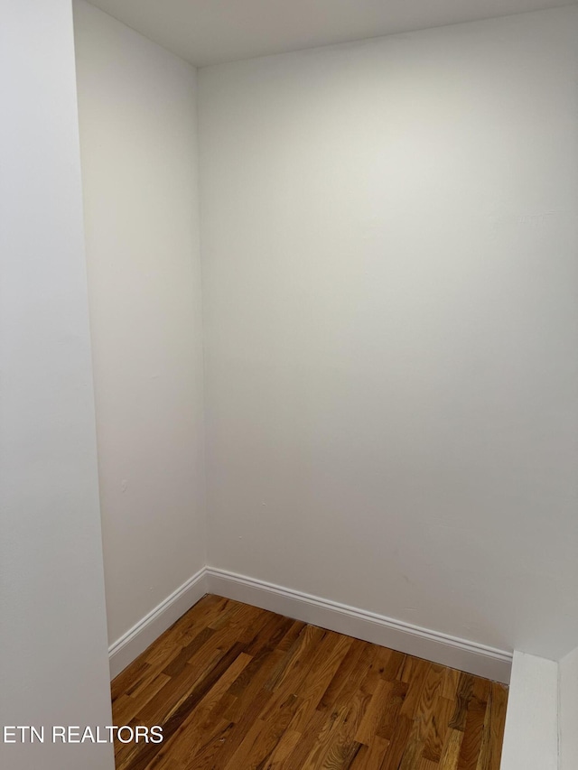 spare room with hardwood / wood-style flooring