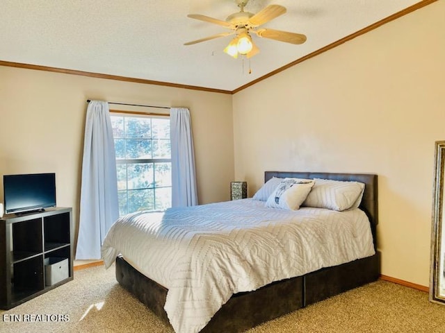 bedroom with ceiling fan, light colored carpet, and a textured ceiling